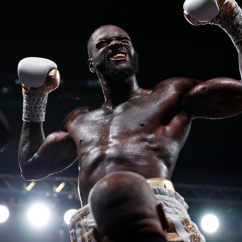 Deontay Wilder celebrates after knocking out Luis 