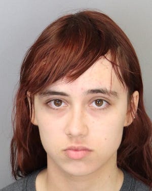 Kyoko Smith, 18, is accused of killing and decapitating her grandmother's Shit Tzu.