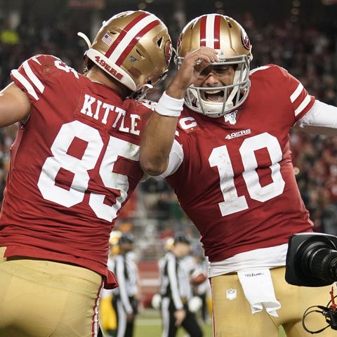 George Kittle (85) and Jimmy Garoppolo celebrate a