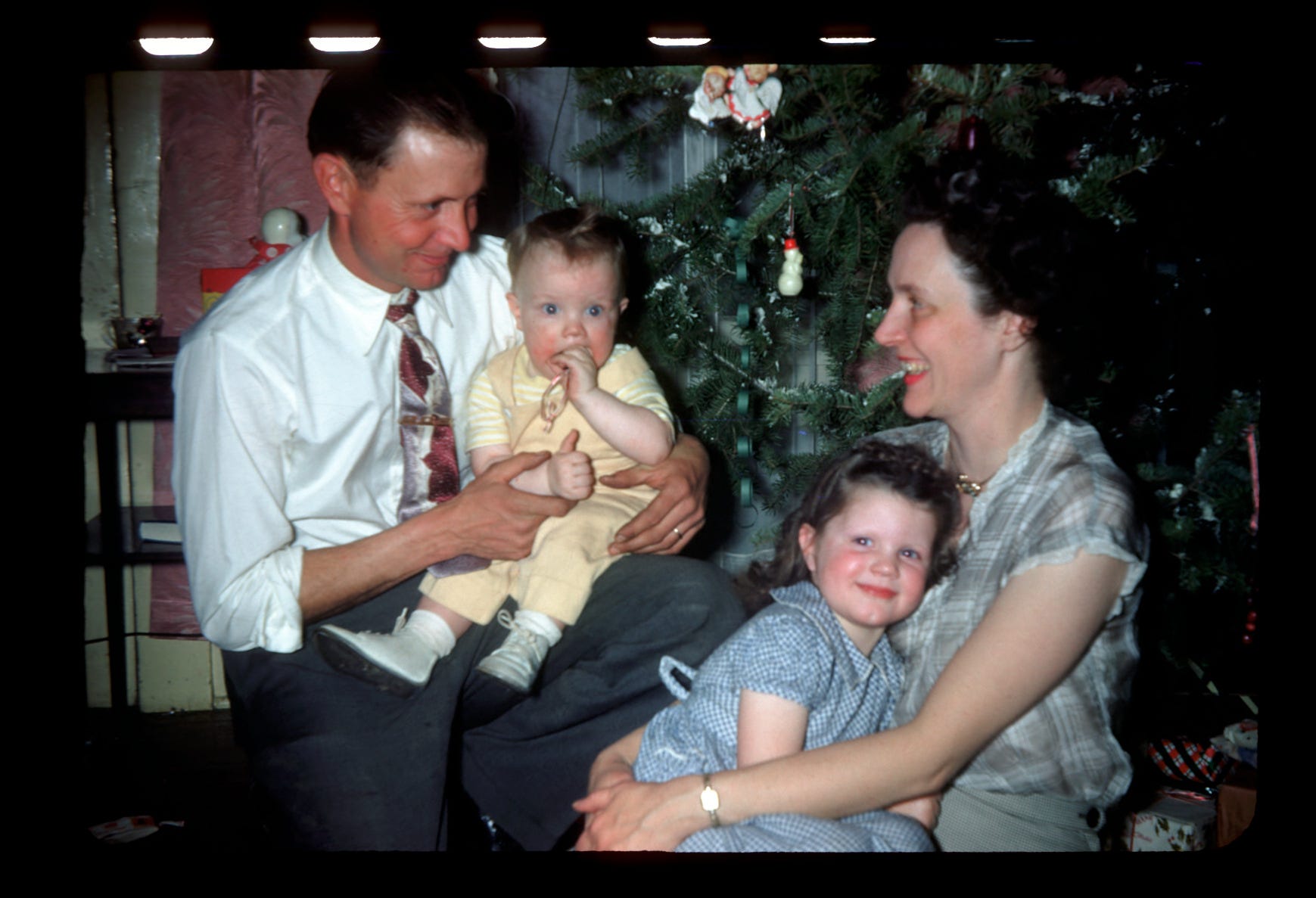 Robert, with son Bob, and Evelyn Birkby, with their daughter, Dulcie Jean, await Santa at Christmas 1950. Evelyn Birkby wrote a  weekly column for Shenandoah newspapers for 70 years before retiring at 100.