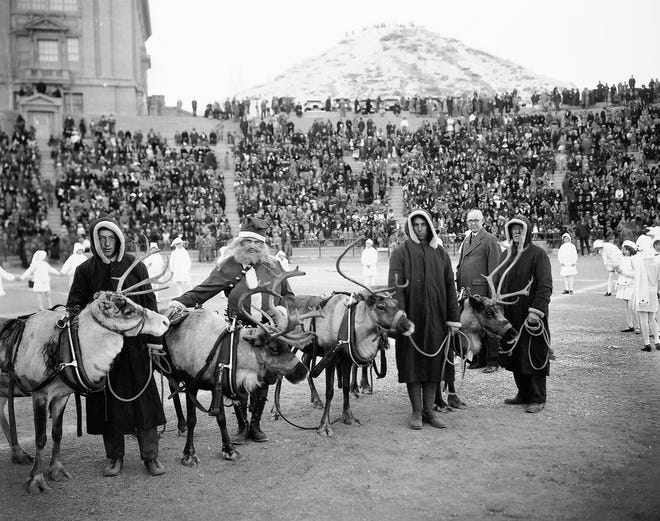 Dec. 24, 1928: Here are Dancer, Prancer, Donner and Blitzen, just after they were presented to the children of El Paso at Sunday's Christmas party. Santa Claus himself presented them. Mayor R.E. Thomason (shown in background) accepted them, on behalf of the children. Child dancers, dressed as snow drops, are shown encircling Santa and his reindeer.