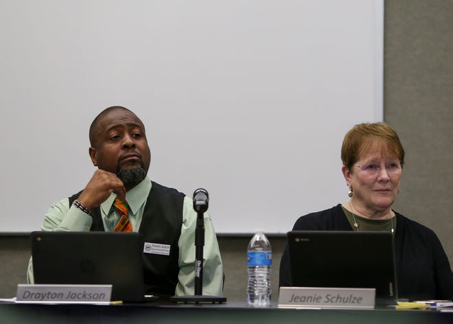 FILE — Central Kitsap school board members Drayton Jackson, left, and Jeanie Schulze listen to students and parents during a school board meeting in 2019. Schulze announced this week she was resigning from the board because of health issues.