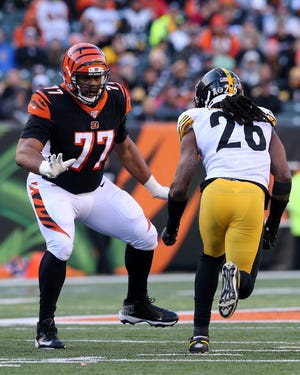 Cincinnati Bengals offensive tackle Cordy Glenn (77) pass blocks against Pittsburgh Steelers inside linebacker Mark Barron (26) in the fourth quarter of an NFL Week 12 game, Sunday, Nov. 24, 2019, at Paul Brown Stadium in Cincinnati. The Pittsburgh Steelers won 16-10, and the Cincinnati Bengals fell to 0-11 on the season. 