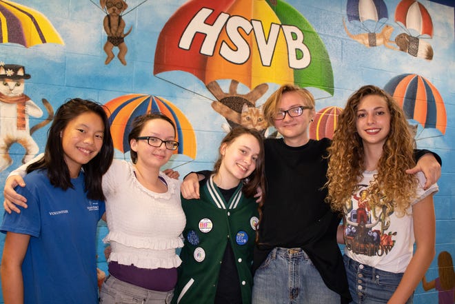 Indian River Charter High School students, led by artist Summer Foster, left, painted this mural on the wall of the cat room at the Humane Society of Vero Beach and Indian River County. Pictured with Foster are Caitlyn Stutsman, Kelsey Jones, Aaron Black and Ally Hannan.