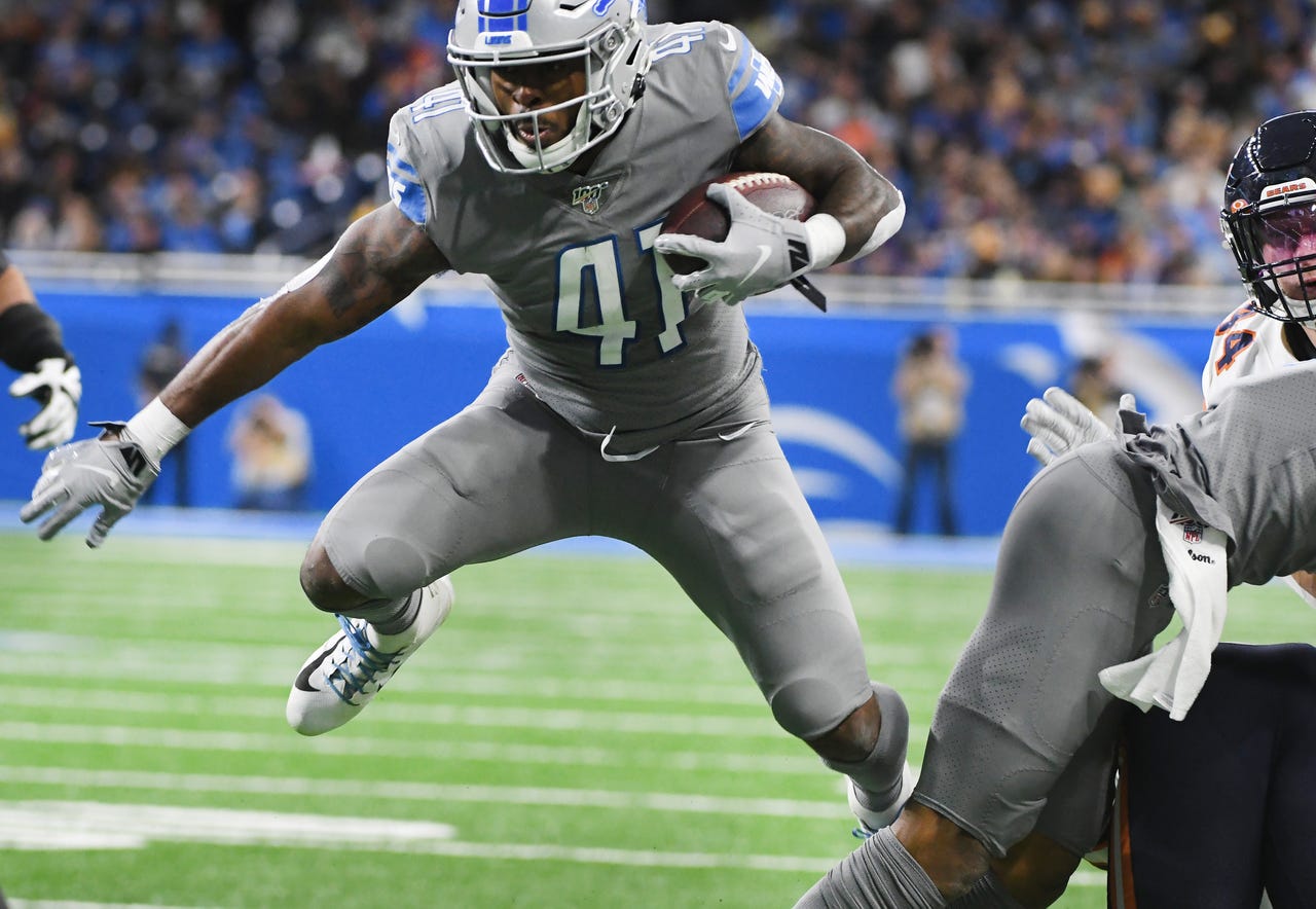 Detroit's J.D. McKissic gets some air charging up field in the first quarter.