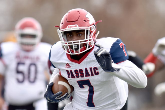 Antrell Monroe, of Passaic, makes his way down field for his teamÕs only touchdown of the game. Clifton defeats Passaic in the final Thanksgiving game in Clifton, N.J. on Thursday Nov. 28, 2019.