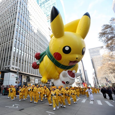 The Pikachu balloon makes its way down 6th Ave. in