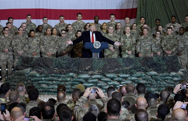 President Donald Trump talks to soldiers during a surprise Thanksgiving visit at Bagram Airport, November 28, 2019 in Afghanistan.
