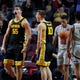 Latest Sports News: Iowa's Luka Garza (55) reacts after scoring against Texas Tech during the first half of an NCAA college basketball game Thursday in Las Vegas.
