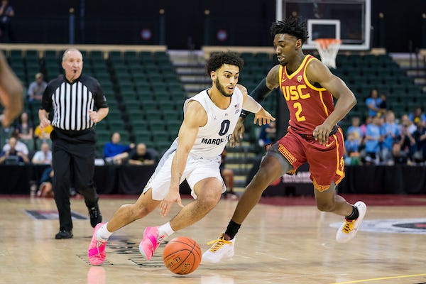 Marquette's Markus Howard drives to the basket against USC on Friday. Howard scored 51 points and has 91 points the first two days of the tournament.