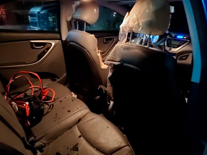 This Friday, Nov. 22, 2019 photo provided by Alyssa Brenteson shows damage to a car vandalized by a bear while it was parked in the Island Air terminal parking lot adjacent to the Kodiak Benny Benson State Airport in Kodiak, Alaska.