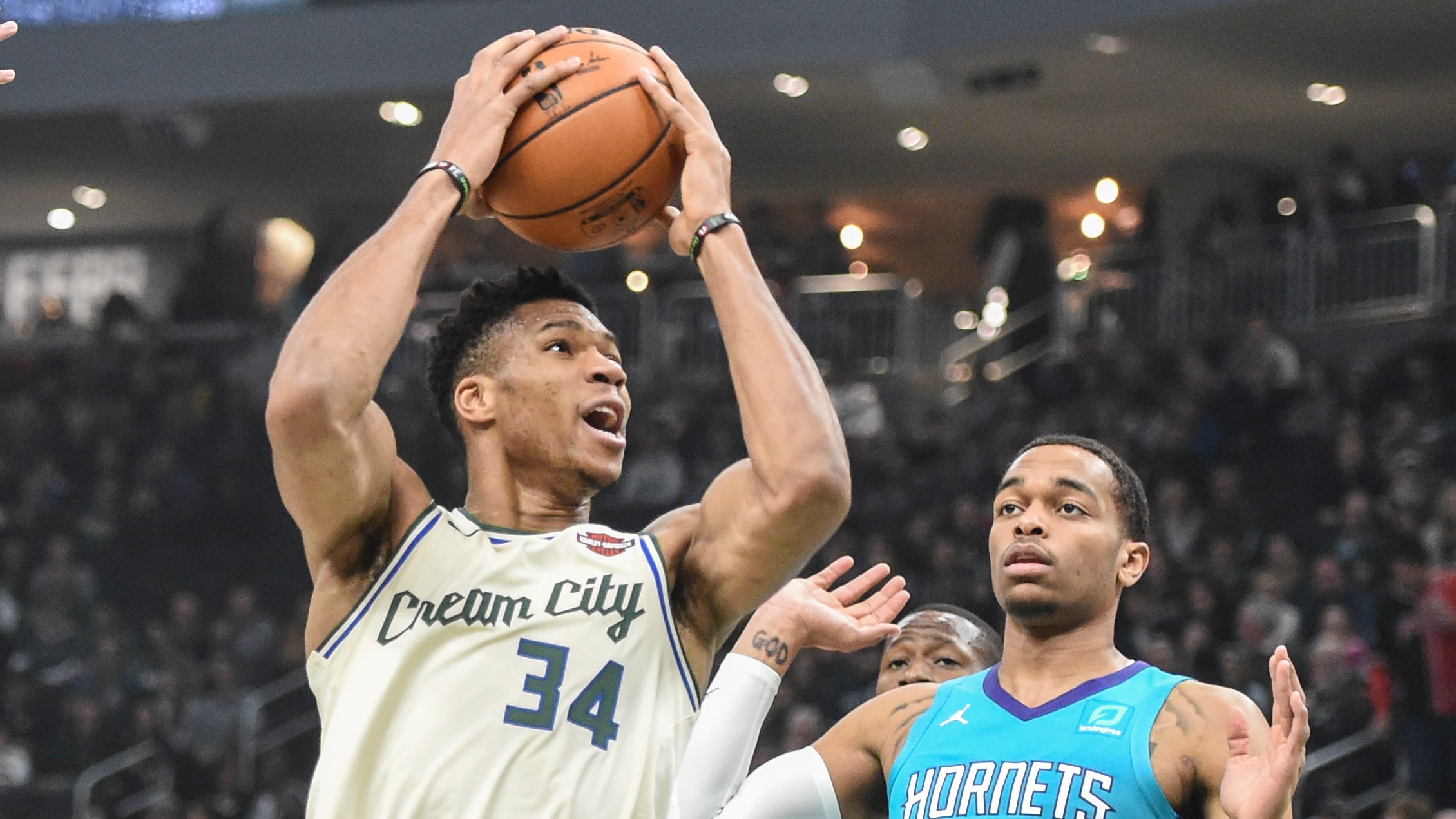 Watch Giannis hand off his game shoes to thrilled Bucks fan