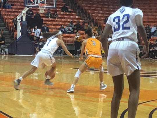 Georgia State's Moriah Taylor drives against the defense of UTEP's Katia Gallegos Saturday night at the Don Haskins Center