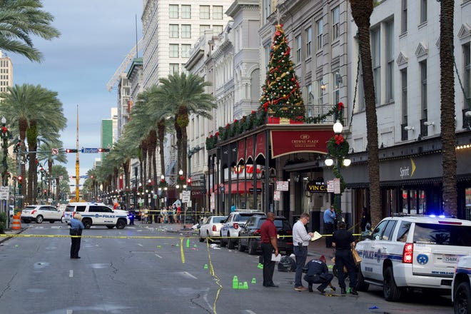New Orleans police investigate the scene of a shooting on Dec. 1, 2019, on the edge of the city's famed French Quarter.