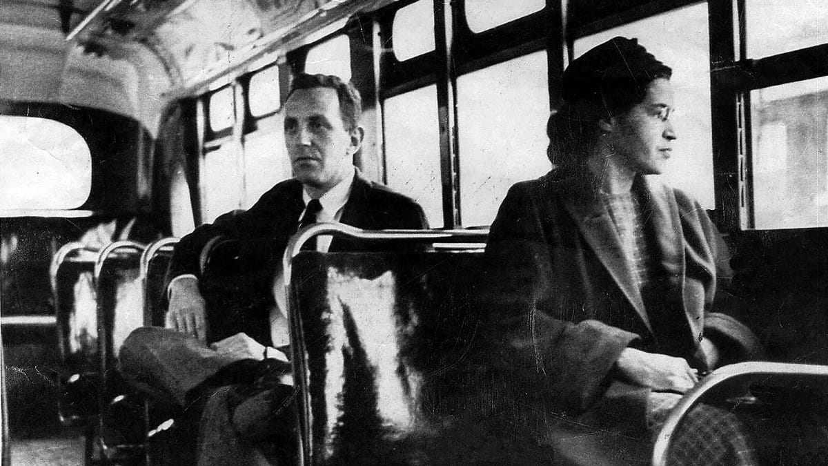 An undated file photo of Rosa Parks riding on a Montgomery Area Transit System bus. Parks refused to give up her seat on a Montgomery bus on Dec. 1, 1955, and ignited the boycott that led to a federal court ruling against segregation in public transportation.