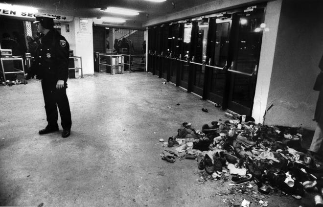 DECEMBER 3, 1979: The Who
Tennis shoes, shirts, jackets and other personal belongings, dropped in the stampede on the arena doors, were swept into a pile inside the empty coliseum lobby.