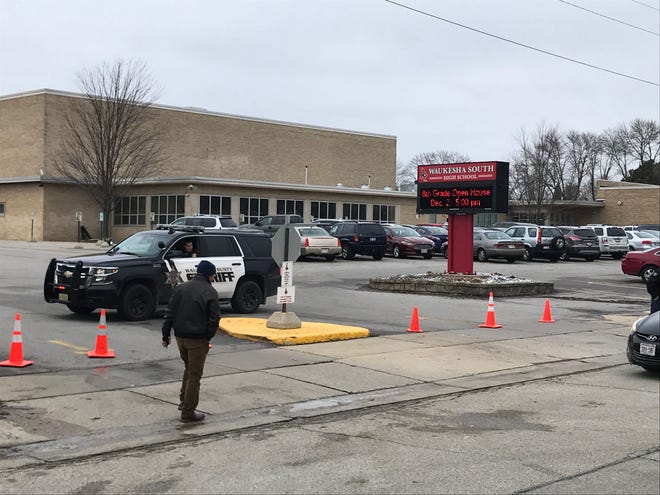 Law enforcement stages outside Waukesha South High School after reports of shots fired inside the school Monday, Dec. 2, 2019.