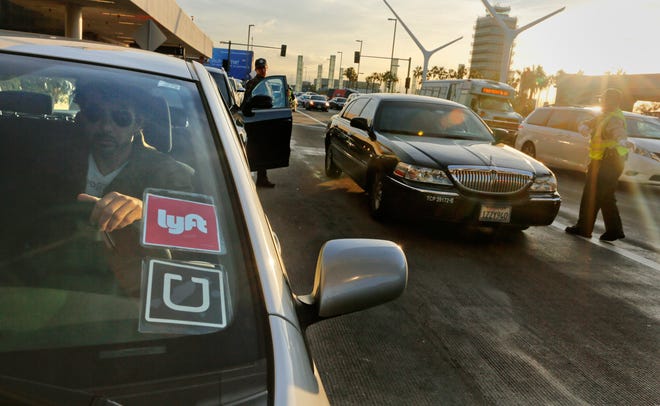 A recent study by AAA contends that replacing a personal vehicle with ride-hailing services could amount to "twice the cost of car ownership." (Mark Boster/Los Angeles Times/TNS)