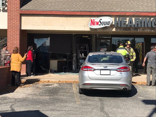 A vehicle collided into a business on Sherwood Way noon, Monday, Dec. 2, 2019. (License plate redacted.)