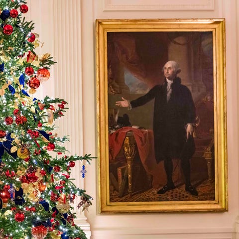 A portrait of George Washington is seen beside a C