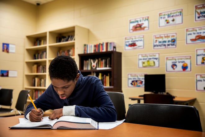 Sha'Rondell Horne, 15, works on his American History vocabulary at The Children's Home of Cincinnati in Madisonville on Tuesday, December 3, 2019.