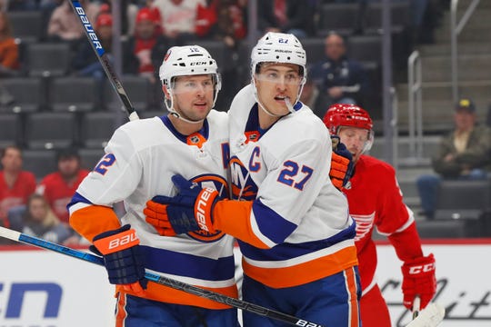 New York Islanders center Anders Lee (27) celebrates his goal with Josh Bailey (12) in the first period Monday.