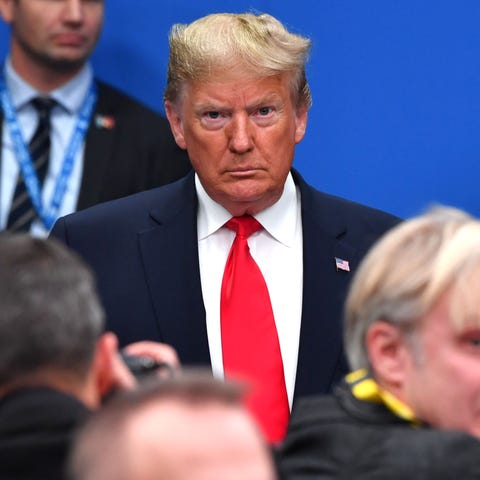President Donald Trump attends the plenary session