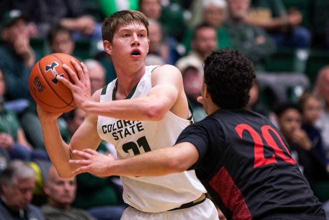 Colorado State University sophomore forward Adam Thistlewood (31) looks to pass over San Diego State University junior guard Jordan Schakel (20) on Wednesday Dec. 4, 2019, at Moby Arena in Fort Collins, Colo. 