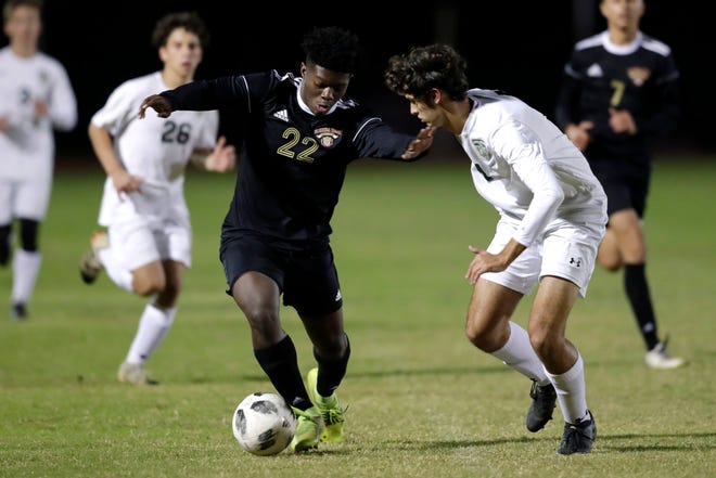 Florida High Seminoles Delali Simpson (22) dribbles the ball down the field.  The Florida High Seminoles hosted the Lincoln Trojans on Wednesday, Dec. 4, 2019. 