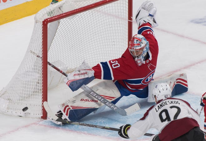 Montreal Canadiens goaltender Cayden Primeau makes a save against Colorado Avalanche's Gabriel Landeskog. He finished with 32 stops.