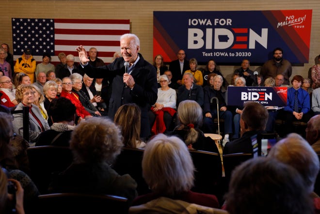 Democratic presidential candidate former Vice President Joe Biden speaks to local residents during a bus tour stop, Tuesday, Dec. 3, 2019, in Mason City, Iowa.