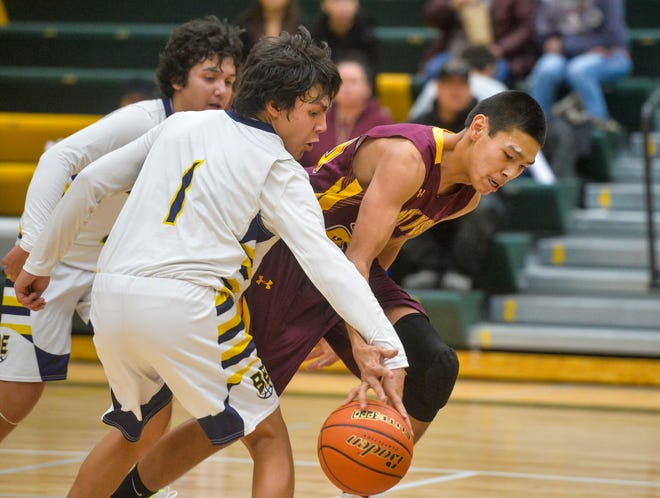 Box Elder's Gabe Saddler attempts to steal the ball from Rocky Boy's Blake Cantrell during Friday's basketball game at the 2019 Native American Basketball Classic in the CMR Fieldhouse.