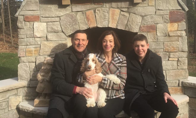The Angeli family of Farmington Hills – from left, Larry (holding the family dog, Lucy), Alice and Anthony – were among the first purchasers of a MiABLE disability savings account. Their aim is to help secure Anthony’s financial  future.