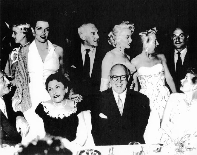 From Left to right, Jane Russell, Louella Parsons (seated), her companion Jimmy McHugh, Marilyn Monroe and Lucille Ball (seated).