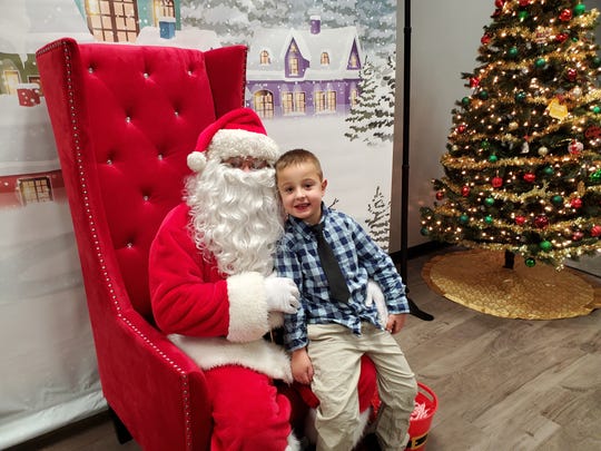 Michael Grzankowski sits on Santa's lap.