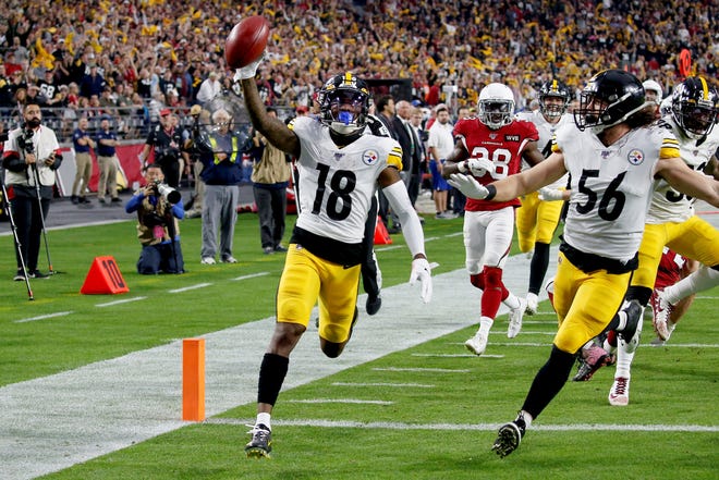 Pittsburgh Steelers wide receiver Diontae Johnson (18) runs in an 85-yard punt return for a touchdown against the Arizona Cardinals during the first half of an NFL football game, Sunday, Dec. 8, 2019, in Glendale, Ariz. (AP Photo/Ross D. Franklin)