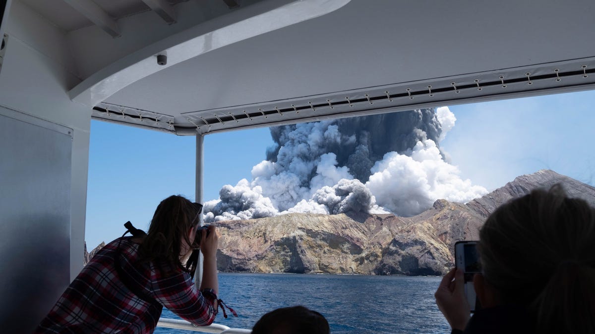 A image provided by visitor Michael Schade shows White Island volcano as it erupts in the Bay of Plenty, New Zealand. According to police, at least five people have died in the volcanic eruption.