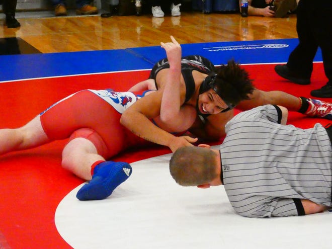 Liberty Union's Kobe Barnett, attempting to pin a Lakewood wrestler,  finished 4-0 and won the 182-pound gold pool championship at the Granville Invitational.
