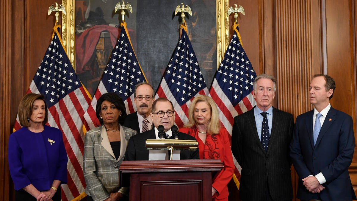 From left House Speaker Nancy Pelosi, D-Calif.; Chairwoman of the House Financial Services Committee Maxine Waters, D-Calif.; Chairman of the House Foreign Affairs Committee Eliot Engel, D-N.Y.; House Judiciary Committee Chairman Jerrold Nadler, D-N.Y.; Chairwoman of the House Committee on Oversight and Reform Carolyn Maloney, D-N.Y.; House Ways and Means Chairman Richard Neal, D-Mass.;  and Chairman of the House Permanent Select Committee on Intelligence Adam Schiff,   D-Calif., unveil articles of impeachment against President Donald Trump, during a news conference Dec. 10, 2019.