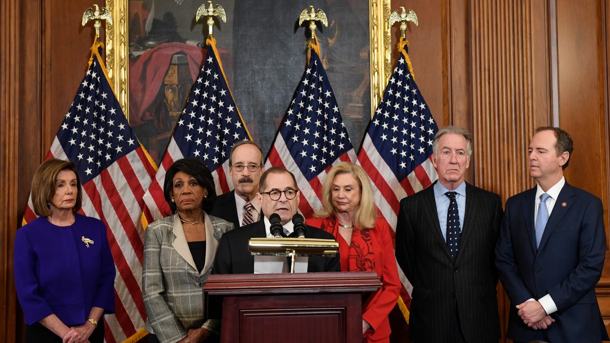 From left House Speaker Nancy Pelosi, D-Calif.; Chairwoman of the House Financial Services Committee Maxine Waters, D-Calif.; Chairman of the House Foreign Affairs Committee Eliot Engel, D-N.Y.; House Judiciary Committee Chairman Jerrold Nadler, D-N.Y.; Chairwoman of the House Committee on Oversight and Reform Carolyn Maloney, D-N.Y.; House Ways and Means Chairman Richard Neal, D-Mass.;  and Chairman of the House Permanent Select Committee on Intelligence Adam Schiff,   D-Calif., unveil articles of impeachment against President Donald Trump, during a news conference Dec. 10, 2019.