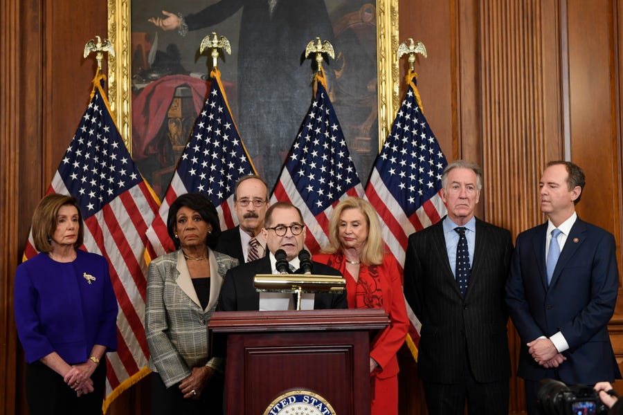 From left House Speaker Nancy Pelosi, D-Calif.; Chairwoman of the House Financial Services Committee Maxine Waters, D-Calif.; Chairman of the House Foreign Affairs Committee Eliot Engel, D-N.Y.; House Judiciary Committee Chairman Jerrold Nadler, D-N.Y.; Chairwoman of the House Committee on Oversight and Reform Carolyn Maloney, D-N.Y.; House Ways and Means Chairman Richard Neal, D-Mass.;  and Chairman of the House Permanent Select Committee on Intelligence Adam Schiff, D-Calif., unveil articles of impeachment against   President Donald Trump, during a news conference Dec. 10, 2019.