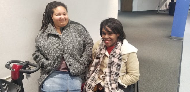 Jamie Junior (L) and Tameka Citchen-Spruce, two disability advocates attended the Detroit Charter Commission meeting Tuesday evening.