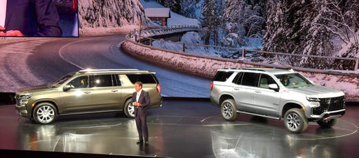 GM President Mark Reuss talks about the Chevy Suburban High Country, left, and Chevy Tahoe Z-71 as GM introduces the 2021 models at Little Caesars Arena, Tuesday night, December 10, 2019.