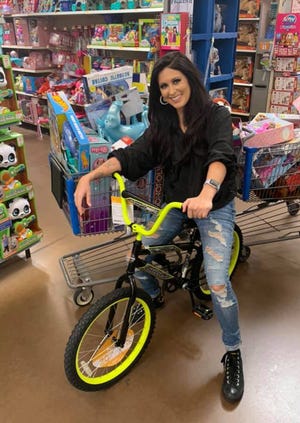 Jessica Meuse with some of the toys recently collected in Montgomery for the toy drive with Eastdale Mall and the Salvation Army.