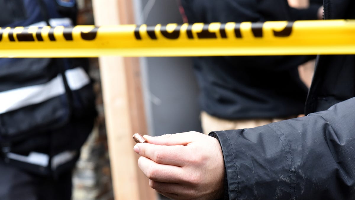 A man shows a bullet that was found inside the Jersey City Kosher Supermarket the morning after a shoot out with police in Jersey City, N.J. on Wednesday Dec. 11, 2019. One police officer, the two shooters and three civilians were killed.
