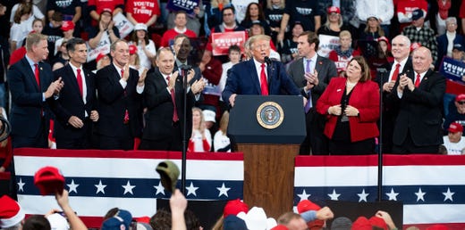 President Donald Trump is joined on stage by prominent Pennsylvania representatives during the President Donald Trump rally in Giant Center in Hershey, Pennsylvania, December 10, 2019.