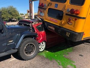 Tempe City Council candidate Marc Norman was involved in a car accident when a Jeep Wrangler rammed into his car, sending it under a school bus, on Tuesday, Dec. 10.