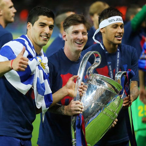 Barcelona players Luis Suarez, Lionel Messi and Ne