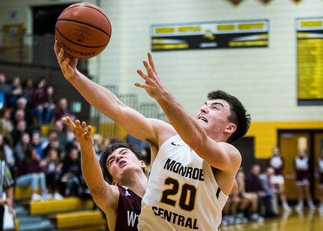 FILE -- Monroe Central's Logan Patterson shoots past Wes-Del's defense during their game at Monroe Central High School Saturday, Dec. 14, 2019.