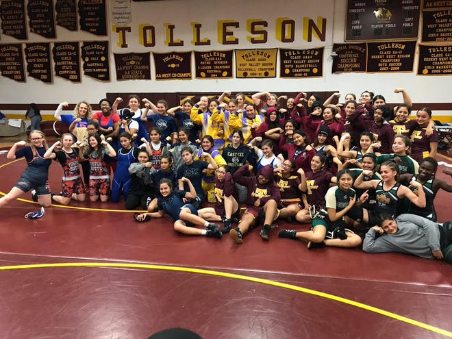 All of the girls wrestlers stand together at the end of the Tolleson All-Girls Classic wrestling tournament at Tolleson High School
